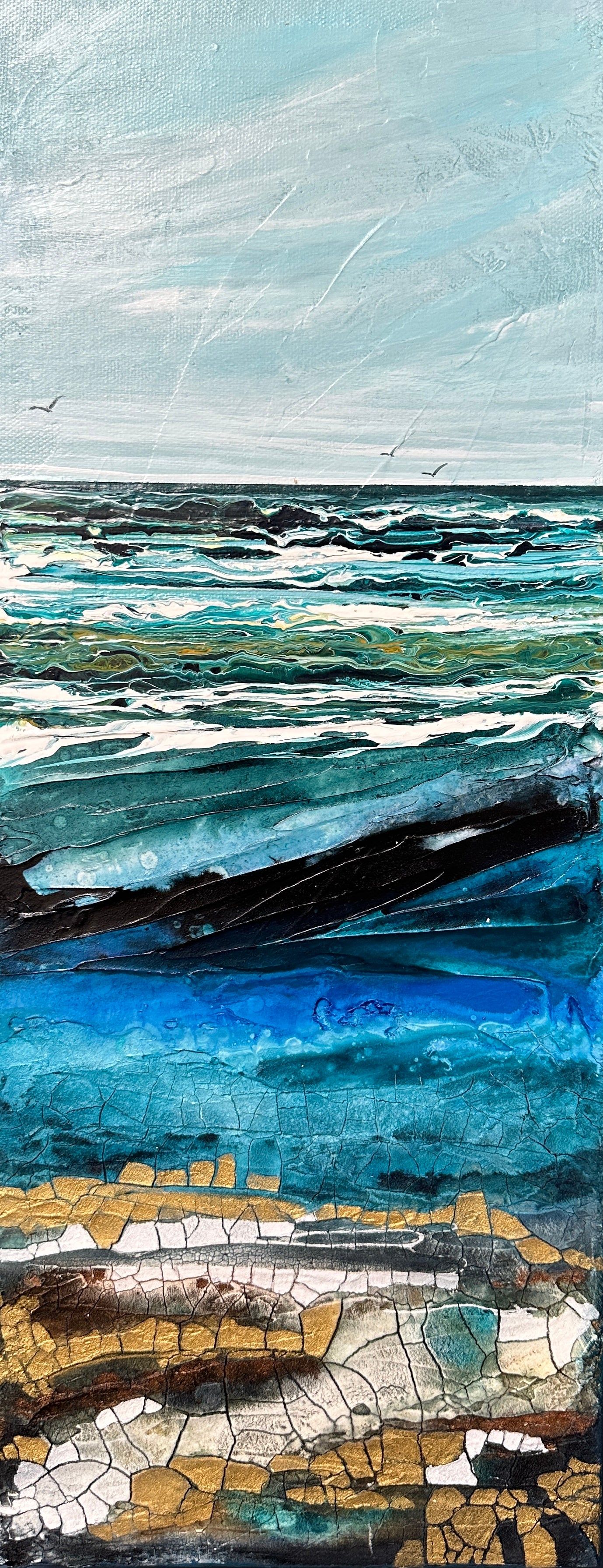 Abstract seascape painting with a texture, golds and blues