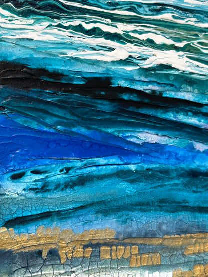 Close-up of a textured surface with blue, white, and gold colors