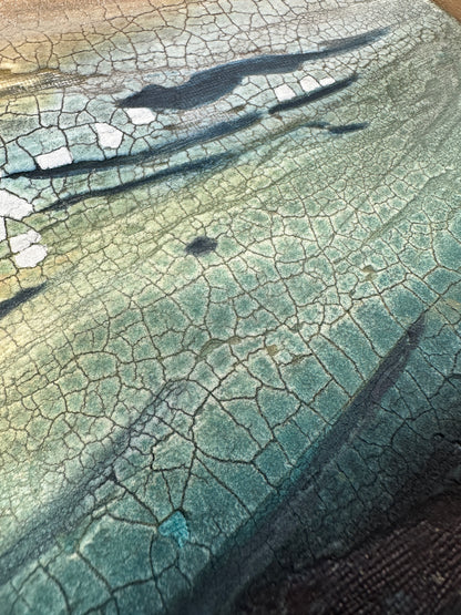 Close-up of a textured painting with a greenish blue tint